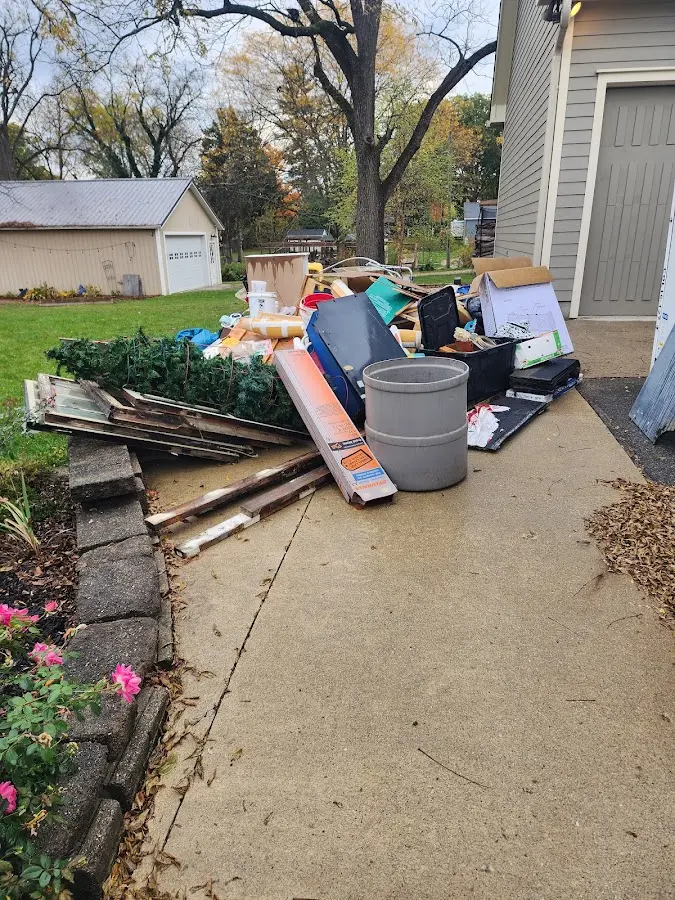 Dumpster being loaded with debris for Residential Dumpster Rental in Mexico